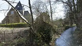 L'église, façade occidentale et la Retourne de Juniville.