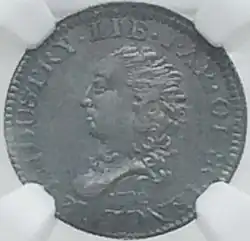 Pièce de monnaie représentante un buste de femme, tournée vers la gauche.