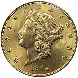 Pièce de monnaie en or représentant le profil gauche d'une femme portant un bonnet avec l'inscription LIBERTY et entourée de 13 étoiles. L'inscription 1904 en bas de la pièce.