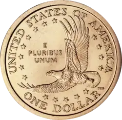 Pièce de monnaie représentant un aigle en vol, entouré d'étoiles et les inscriptions UNITED STATES OF AMERICA, One dollar et E Pluribus Unum.