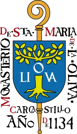 Sceau montrant une crosse surmontée d'un écu frappé d'un olivier, et entouré du texte « Monasterio de Sta Maria de La Oliva — Carcastrilo — Año 1134.