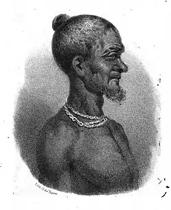 Portrait de Badu Bonsu II lors de sa capture, avant sa pendaison, avec des chaînes autour du cou.