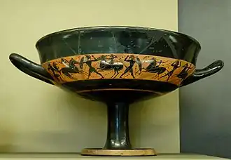 Scène de combats. Coupe à bandes attique à figures noires, vers -540.