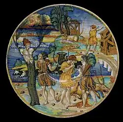 Trois scènes du mythe de Cyparisse sur un émaux à lustre métallique du XVIe&nbsp;siècle par Giorgio Andreoli ; le dieu qui embrasse le jeune qui se transforme tient une branche dans sa main.