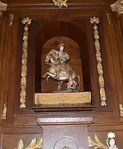 Groupe sculpté Saint-Martin et le pauvre en bois taillé polychrome du XVIIe&nbsp;siècle .