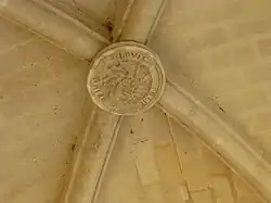 Clé de voûte du porche,LOVIS PETIT MAIRE 1869.