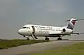 Fokker 70 sur l’aire de stationnement de Quimper (1996).