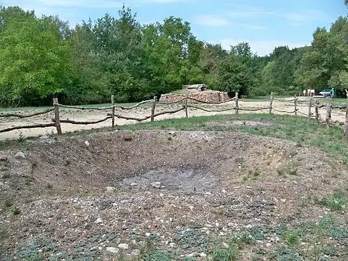 Fosse avec reliquat de combustion