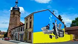 Fresque murale relatant le passé historique de la commune en lien avec la Papeterie.