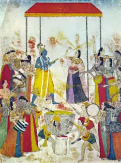 Miniature représentant Krishna et Radha célébrant la Holi, parmi les gopi et les bouviers.