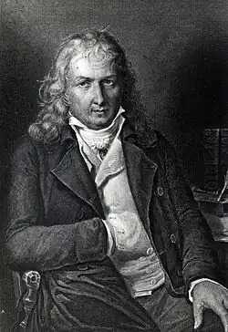 Gravure montrant Bernardin de Saint-Pierre assis sur une chaise, dos à son bureau