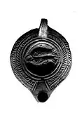 Lampe paléochrétienne de Samos à deux poissons accolés.