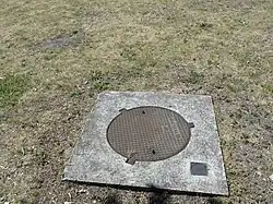 La tête de puits matérialisée.