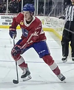 Photographie couleur d'un joueur de hockey sur glace