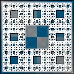 Face d'une éponge de Menger, ou tapis de Sierpiński.