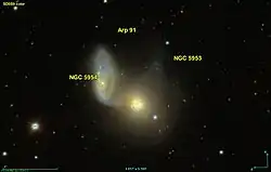 La paire de galaxies en interaction gravitationnelle NGC 5954 et NGC 5954 figure dans l'atlas de Halton Arp comme Arp 91.