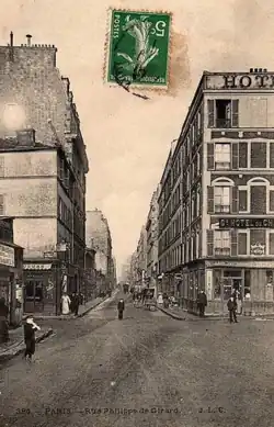 La rue Philippe-de-Girard au croisement de la rue du Département, vers 1900.
