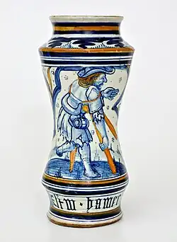 Albarello de pharmacie décoré d'un motif « feuille froissée », sur le devant la figure d'un homme avec des béquilles, Pesaro, fin XVe&nbsp;siècle.