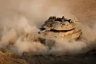 Un Merkava Mk. 4M du 82e&nbsp;bataillon évoluant le long de la frontière bordant Gaza lors de l'opération Aube naissante.