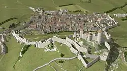 Restitution 3D au milieu du XVe siècle. Vue de l'est en plongée du château de Grimont et du bourg fortifié de Poligny (extrait de http://www.jura-3d.fr).