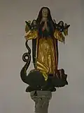 Statue de Sainte Marguerite dans la chapelle, bois polychrome.