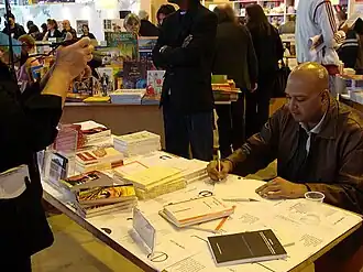 Yusuf Kadel au Salon du Livre