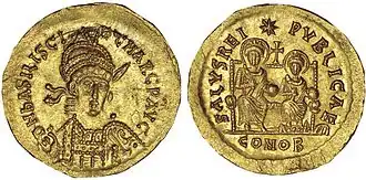 Photographie des deux faces d'une pièce en or.