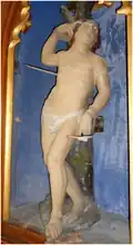 Saint Sébastien (saint antipesteux), en pierre polychrome du XVIe&nbsp;siècle (ISMH 18/08/1985).