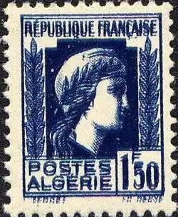 Photographe d'un timbre postal imprimé en bleu sur papier blanc avec deux motifs presque superposés.