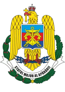 Armoiries de l'état major des trois armes (bleu-ciel : air, rouge : terre, bleu-mer : marine)