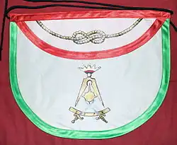 tablier maçonnique portant un compas ouvert et deux épées entrecroisées