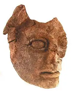 Tête en terre cuite.
