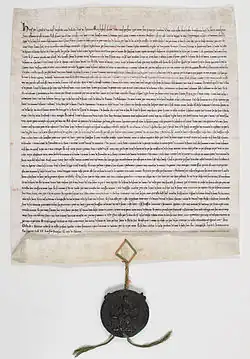 Manuscrit en vieux français, scellé du sceau de Henri III en cire verte sur cordonnets de soie rouge et verte.