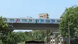 A metro train on an elevated viaduct