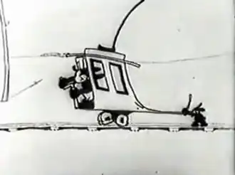 Le wagon d'Oswald est déformé par quelqu'un qui le retient.