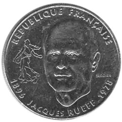 Photo d'une pièce de monnaie avec la Semeuse en petit, et en grand le visage de Rueff, avec son nom en dessous