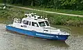 Bateau WSP 11 de la Wasserschutzpolizei sur le Mittellandkanal près de Hanovre.