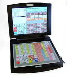 Photo d’une caisse enregistreuse de grand magasin, moderne, semblable à un ordinateur portable.