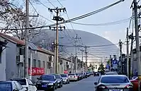 Vers l'Est et le Grand Théâtre National depuis le hutong Dongrongxian. Projets de rénovations en cours en 2019.