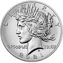 Pièce de monnaie représentant le profil gauche d'une femme aux cheveux longs, portant une couronne et les inscriptions LIBERTY, IN GOD WE TRUST ET 1964.