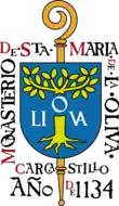 Sceau montrant une crosse surmontée d'un écu frappé d'un olivier, et entouré du texte « Monasterio de Sta Maria de La Oliva — Carcastrilo — Año 1134.