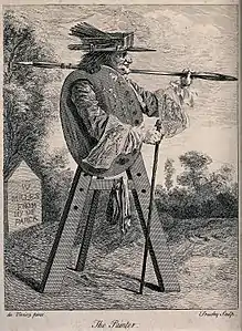 An artist's easel with the figure of a man holding a large paint brush, gravure d'après un certain du Viviez (Wellcome Collection).