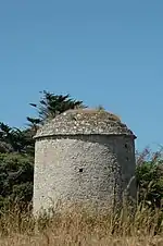 Photo d’un édifice circulaire en pierre.