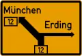 L'ancien panneau poteau indicateur (1956–1971).