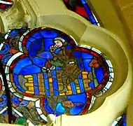 Ouillage par un moine, vitrail du XIIIe&nbsp;siècle.