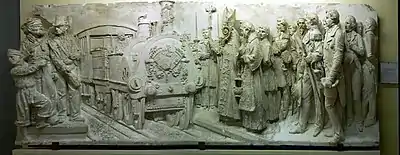 La Benedicció del tren, (XIXe&nbsp;siècle), Francesc Pagès i Serratosa (Barcelone, 1852-1899) Relief original en plâtre, socle de l'allégorie du chemin de fer en bronze sur la façade du palais de justice de Barcelone. Il est conservé au musée Mataró (numéro de catalogue MCMM 5415).