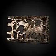 Boucle de ceinture (thème chrétien) en bronze, avant le VIIe&nbsp;siècle.