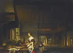 Intérieur de cuisine avec une femme cuisinant et un garçon soufflant sur les flammes