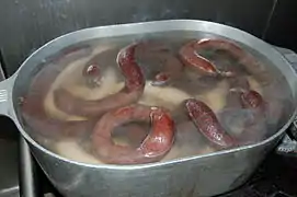 Cuisson conjointe de boudins noir et blanc