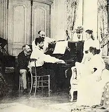 Debussy déchiffrant la partition de Boris Godounov en présence de Chausson